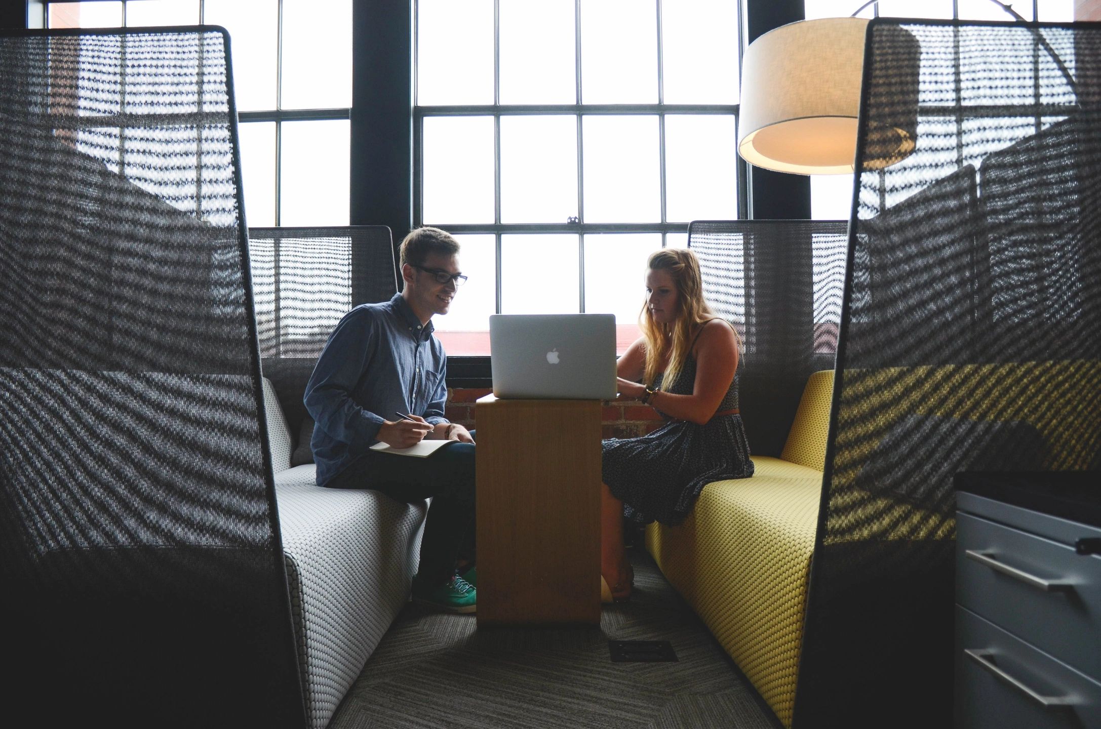 two people working on a computer to learn how to write